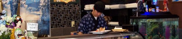chef working at sushi bar